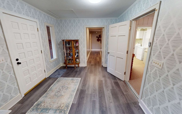 hall featuring washer / clothes dryer and dark wood-type flooring