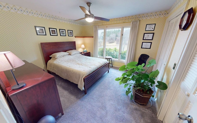 carpeted bedroom with ceiling fan