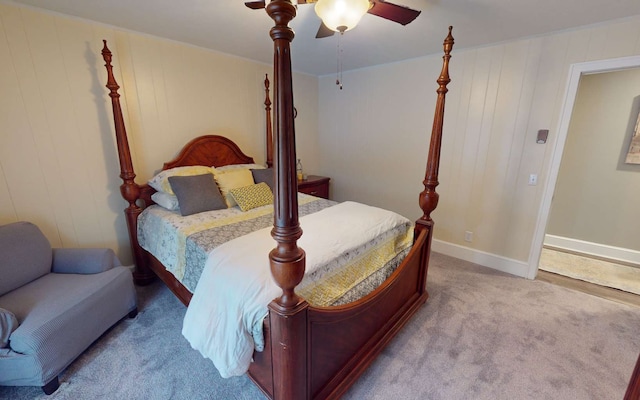 bedroom with ceiling fan and light colored carpet