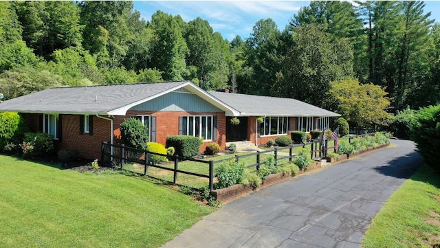 ranch-style house with a front lawn