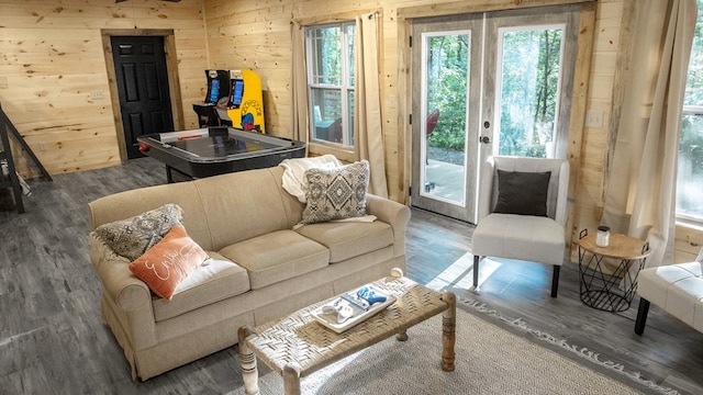 living room featuring hardwood / wood-style flooring and wood walls