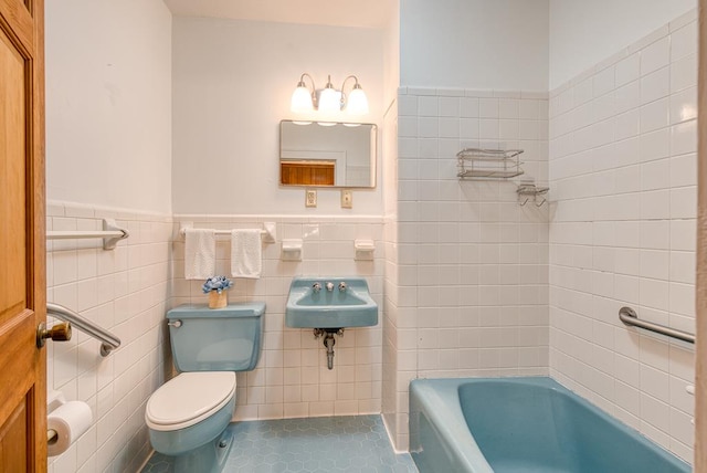 2915 Airport Rd, Marble, NC 28905 - full bathroom featuring tile walls, a wainscoted wall, toilet, a sink, and tile patterned flooring