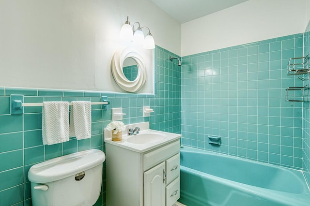 2915 Airport Rd, Marble, NC 28905 - bathroom featuring tile walls, toilet, vanity,  shower combination, and wainscoting