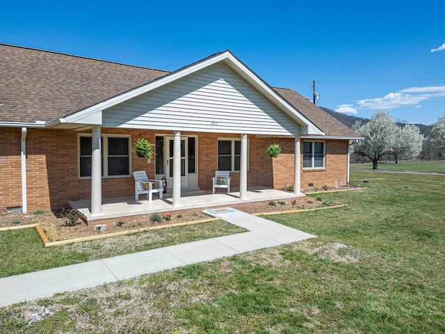 2915 Airport Rd, Marble, NC 28905 - ranch-style home with crawl space, a front yard, brick siding, roof with shingles, and covered porch