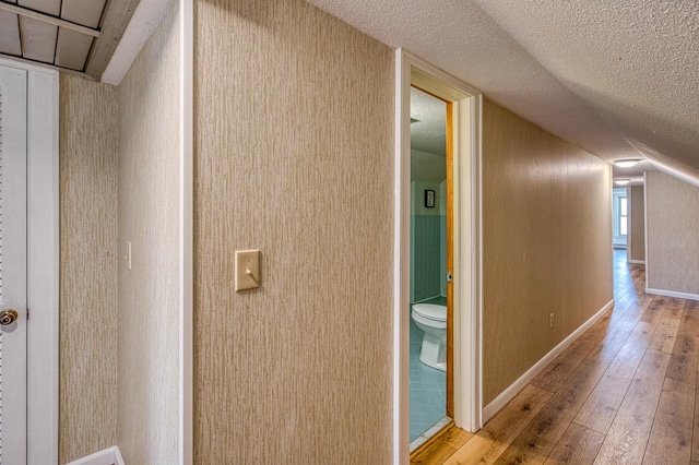 2915 Airport Rd, Marble, NC 28905 - corridor featuring hardwood / wood-style flooring, baseboards, and a textured ceiling