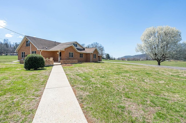 2915 Airport Rd, Marble, NC 28905 - view of front of property with brick siding, covered porch, and a front yard