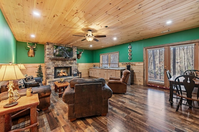 30 The Forest Rd, Blue Ridge, GA 30513 - living room featuring wainscoting, wood ceiling, a fireplace, a ceiling fan, and dark wood-style flooring