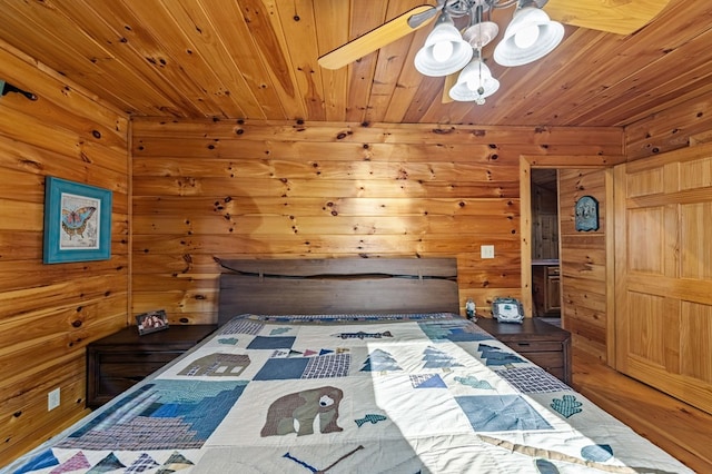 30 The Forest Rd, Blue Ridge, GA 30513 - bedroom with wooden ceiling, wooden walls, wood finished floors, and a chandelier