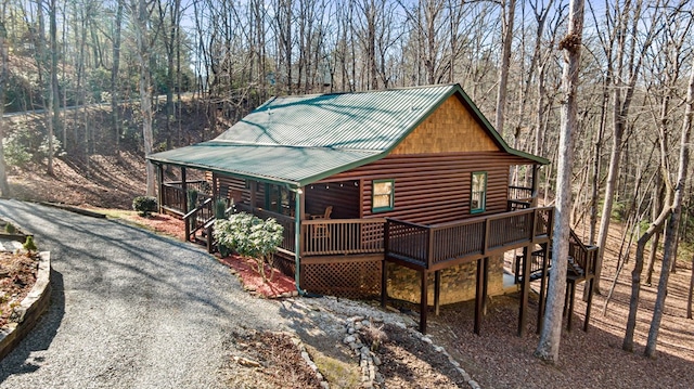 30 The Forest Rd, Blue Ridge, GA 30513 - chalet / cabin with log veneer siding, metal roof, a deck, and view of wooded area