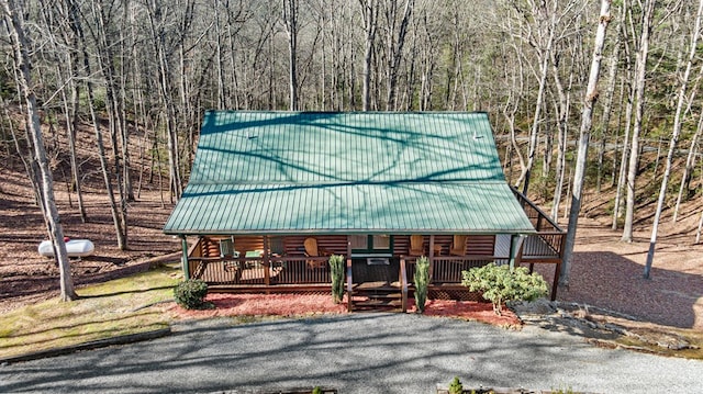 30 The Forest Rd, Blue Ridge, GA 30513 - view of front facade with metal roof, log siding, a porch, and a wooded view