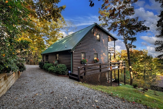 view of side of property with a deck