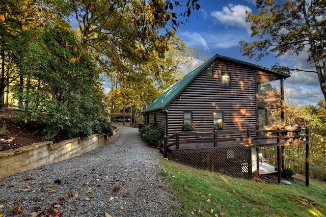 view of side of home with a deck