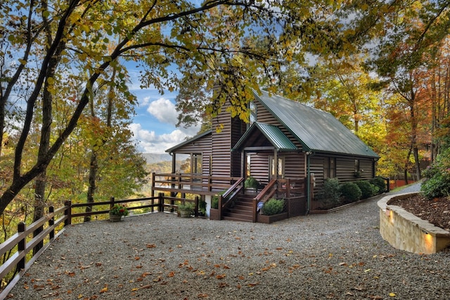 view of home's exterior with a wooden deck