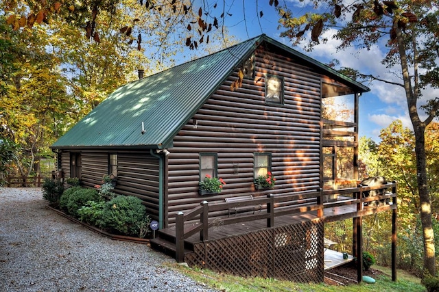 view of side of home featuring a deck