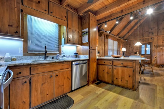 kitchen featuring wood walls, sink, wood ceiling, light hardwood / wood-style flooring, and pendant lighting