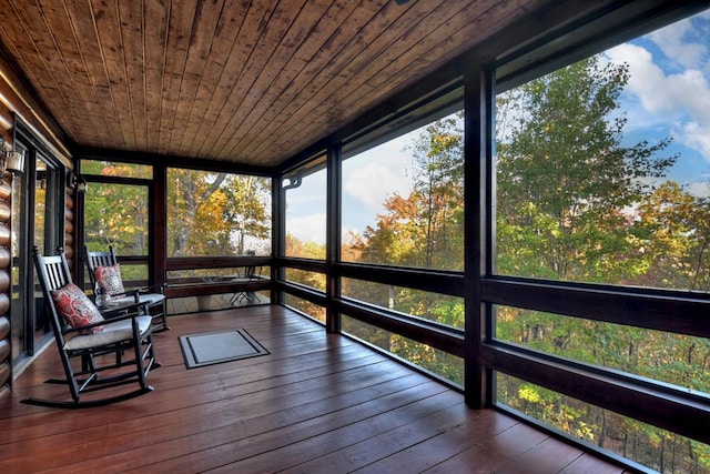 unfurnished sunroom with wooden ceiling