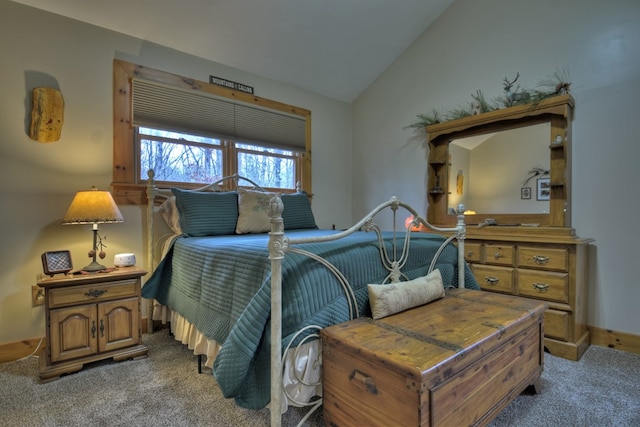 bedroom with carpet flooring and vaulted ceiling