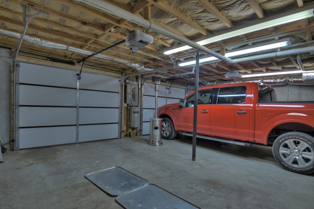 garage featuring electric panel and a garage door opener