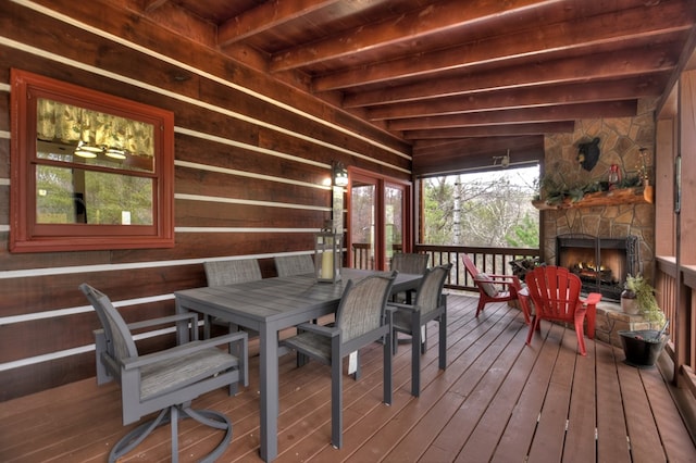 deck featuring an outdoor stone fireplace