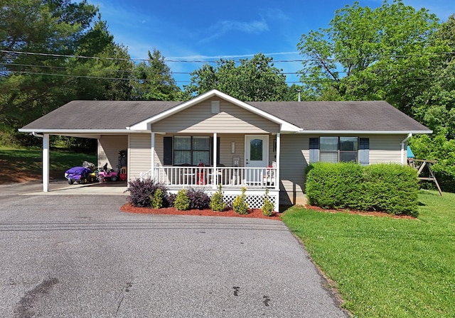 single story home with a front yard, a porch, and a carport