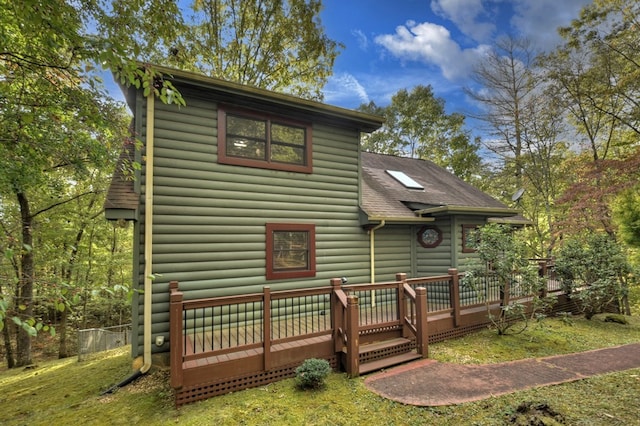 112 Songbird, Blue Ridge, GA 30513 - back of property with a deck, a shingled roof, and faux log siding