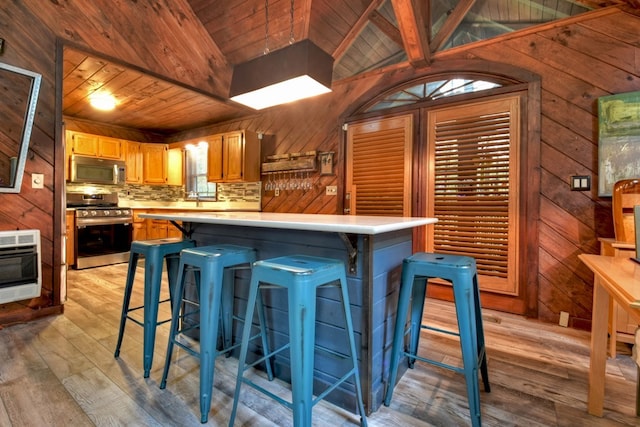 112 Songbird, Blue Ridge, GA 30513 - kitchen featuring stainless steel appliances, wood ceiling, light wood-style floors, light countertops, and heating unit