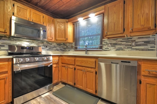 112 Songbird, Blue Ridge, GA 30513 - kitchen featuring appliances with stainless steel finishes, wood ceiling, light countertops, light wood-style flooring, and tasteful backsplash