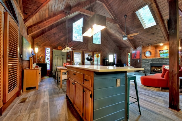 112 Songbird, Blue Ridge, GA 30513 - kitchen with a skylight, high vaulted ceiling, light wood-type flooring, wooden ceiling with exposed beams, and a center island