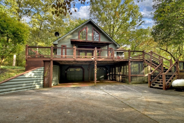 112 Songbird, Blue Ridge, GA 30513 - view of front of house with stairway, driveway, a wooden deck, a carport, and a garage