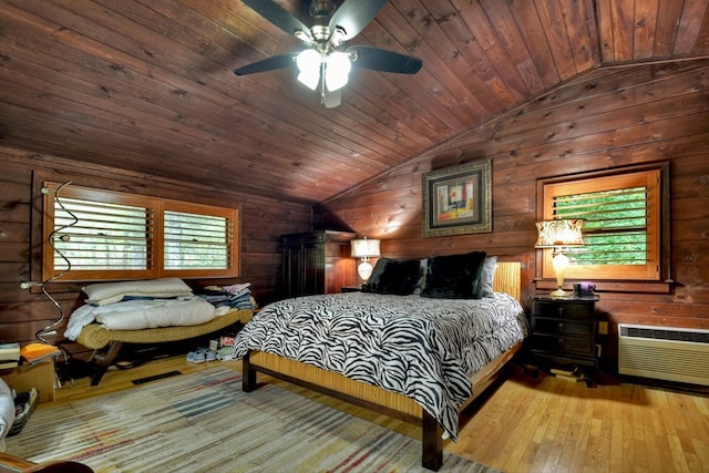 112 Songbird, Blue Ridge, GA 30513 - bedroom with lofted ceiling, hardwood / wood-style flooring, wood walls, a wall unit AC, and wooden ceiling