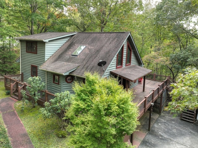 112 Songbird, Blue Ridge, GA 30513 - view of front facade with a deck, roof with shingles, and log veneer siding