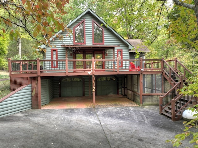 112 Songbird, Blue Ridge, GA 30513 - view of front facade featuring stairs, driveway, a garage, and a wooden deck