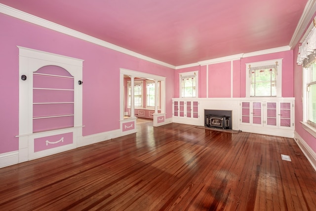 10 New Town St, Tate, GA 30177 - unfurnished living room featuring a wood stove, hardwood / wood-style flooring, ornate columns, ornamental molding, and baseboards