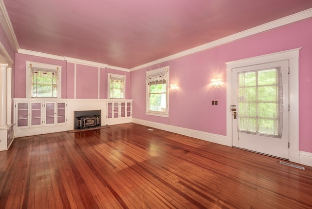 10 New Town St, Tate, GA 30177 - unfurnished living room with a wood stove, hardwood / wood-style floors, ornamental molding, and baseboards