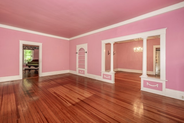 10 New Town St, Tate, GA 30177 - spare room featuring hardwood / wood-style flooring, crown molding, a chandelier, and baseboards