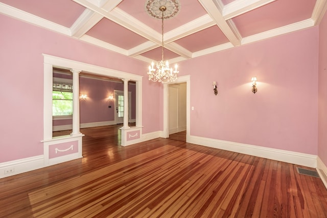 10 New Town St, Tate, GA 30177 - spare room featuring coffered ceiling, a chandelier, beamed ceiling, wood finished floors, and decorative columns
