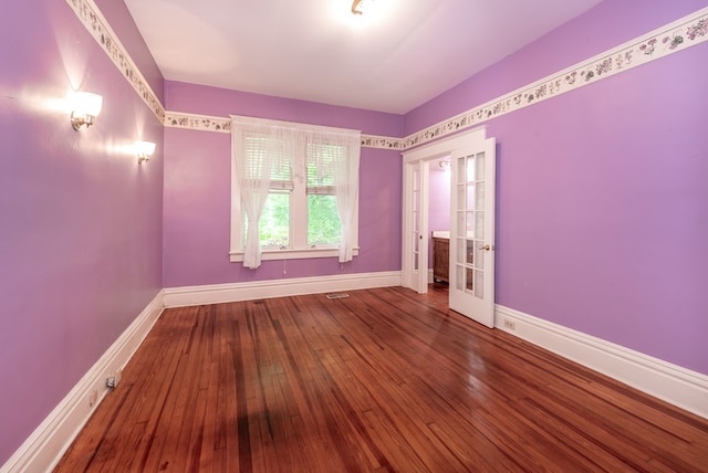 10 New Town St, Tate, GA 30177 - spare room with baseboards, hardwood / wood-style flooring, and french doors