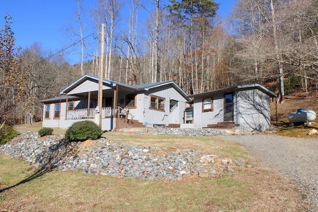 view of front of home with a front lawn and covered porch