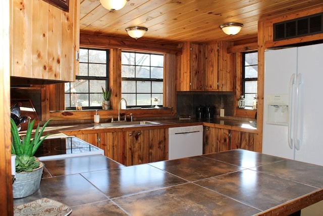 kitchen with white appliances, sink, decorative backsplash, kitchen peninsula, and wood ceiling