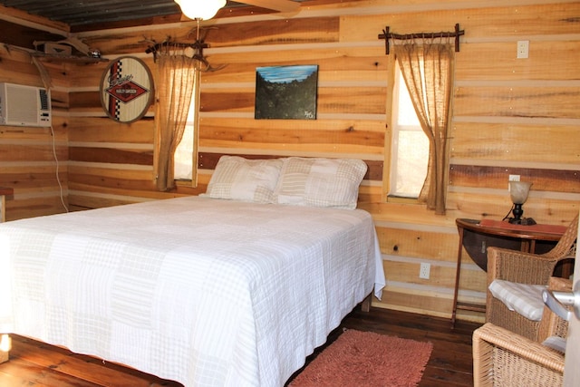 bedroom with hardwood / wood-style flooring