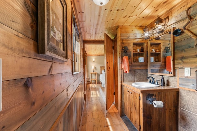 3660 Downings Creek Rd, Hayesville, NC 28904 - bathroom featuring vanity, hardwood / wood-style flooring, wooden walls, and wood ceiling