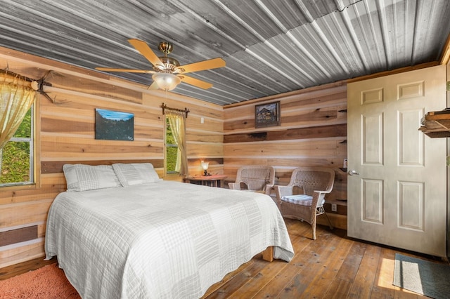 3660 Downings Creek Rd, Hayesville, NC 28904 - bedroom with wood walls, hardwood / wood-style floors, and ceiling fan