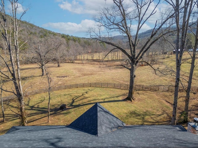 view of yard featuring a rural view and a mountain view