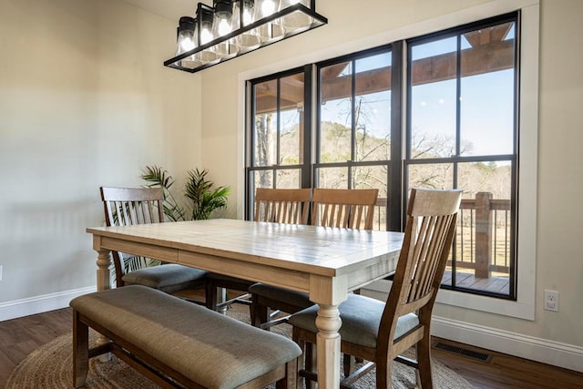 dining area featuring dark hardwood / wood-style floors