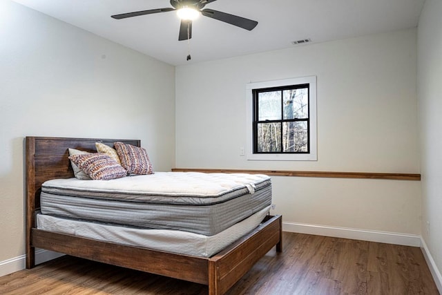 bedroom featuring wood-type flooring and ceiling fan