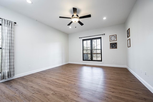 spare room featuring ceiling fan and hardwood / wood-style floors