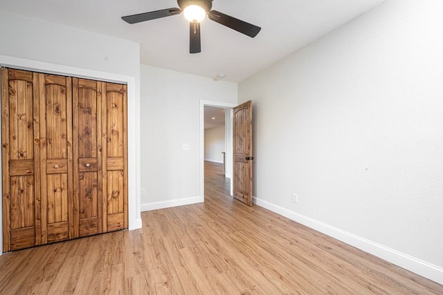 unfurnished bedroom with ceiling fan and light hardwood / wood-style flooring