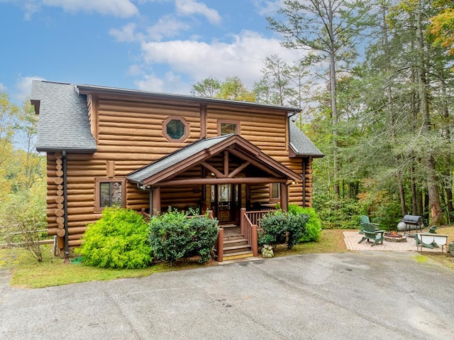 cabin featuring covered porch