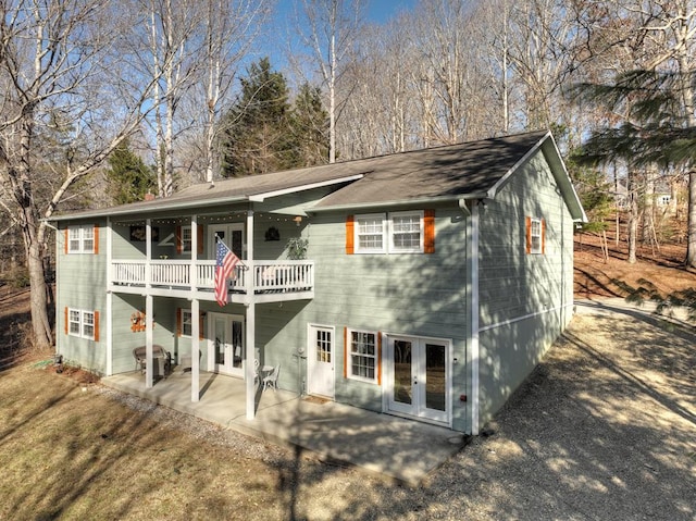 rear view of house with french doors and a patio