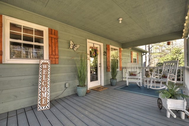 wooden terrace with a porch